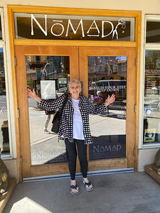 Catherine in front of Nomad Bead Merchants store.